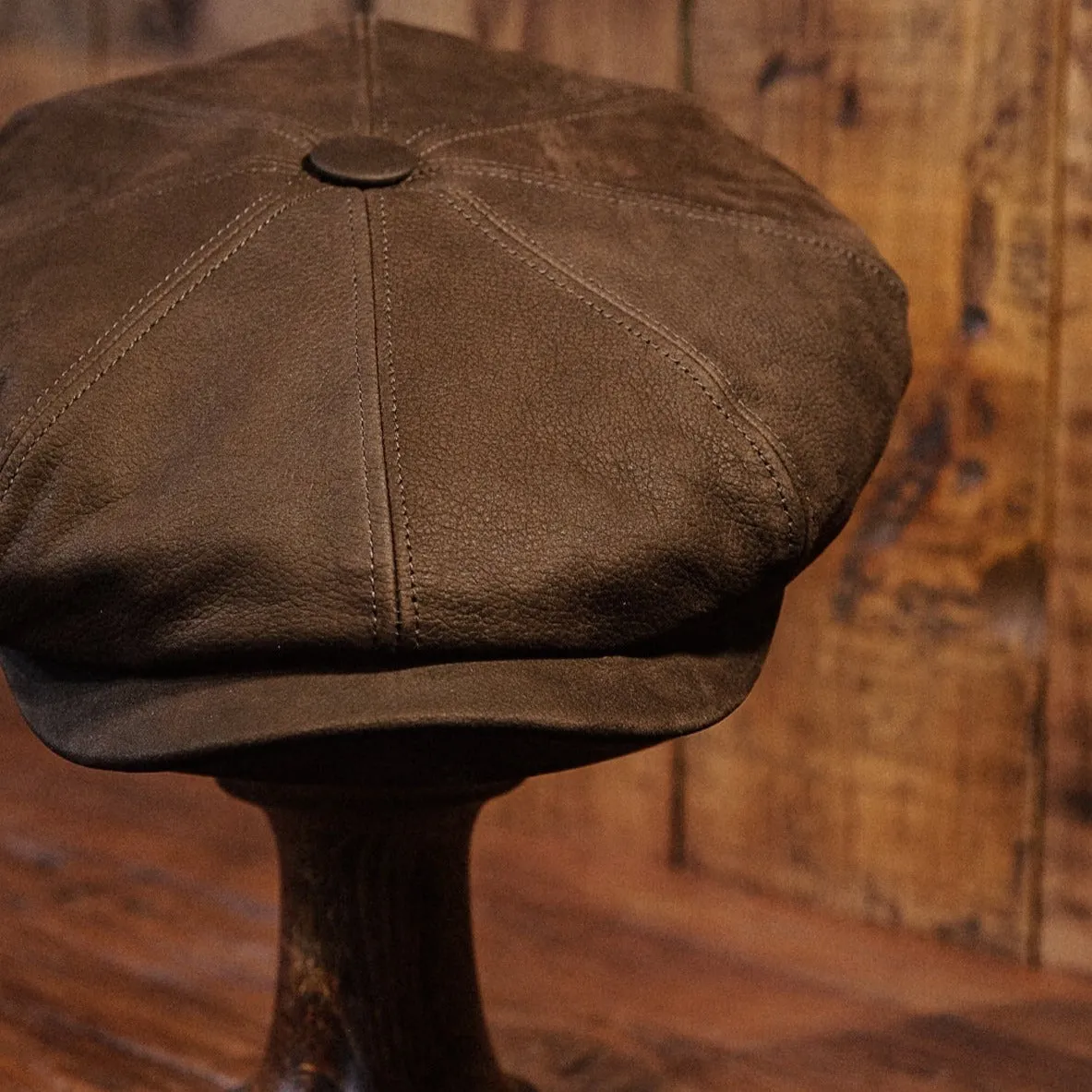 Eight Piece Brown Leather Newsboy Cap