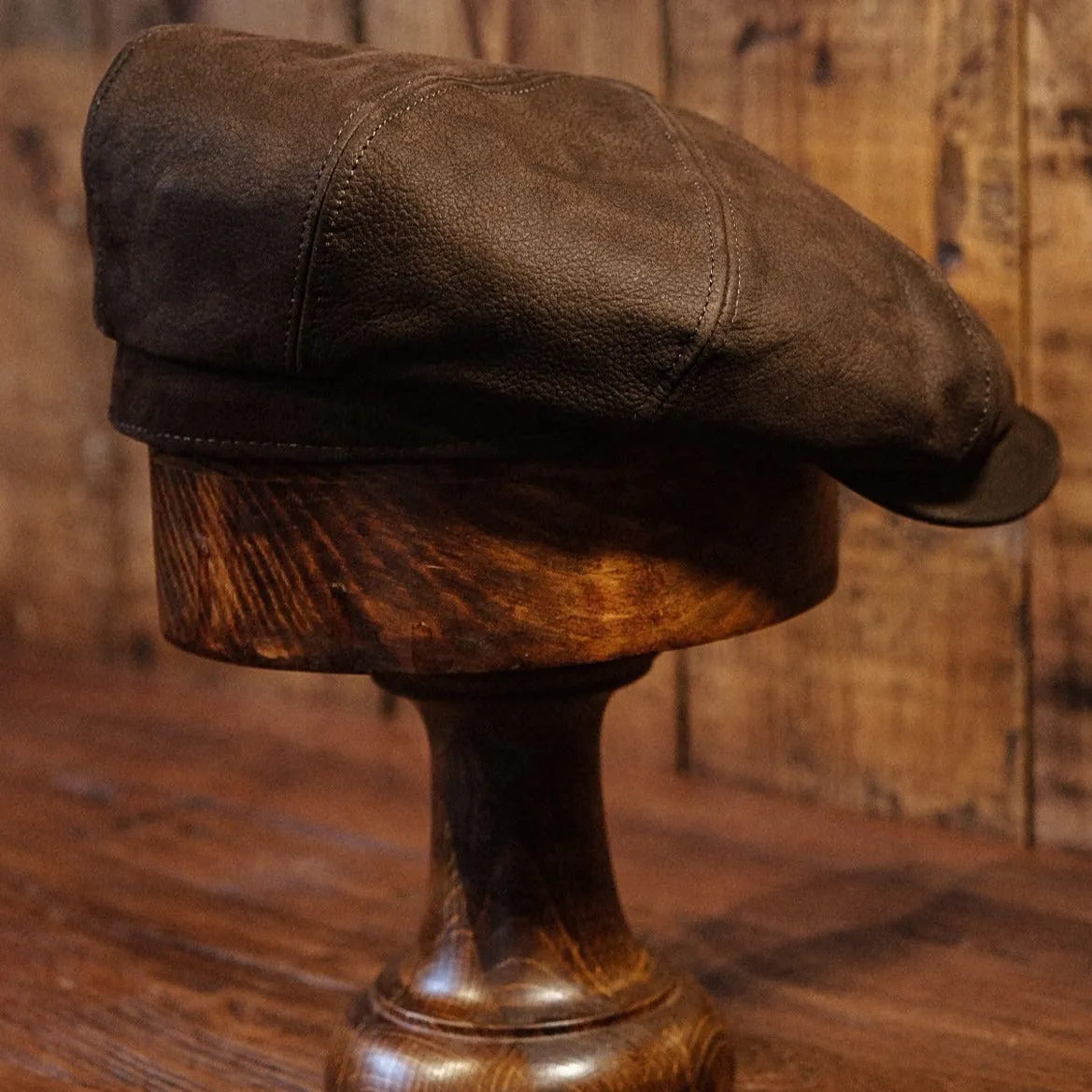 Eight Piece Brown Leather Newsboy Cap