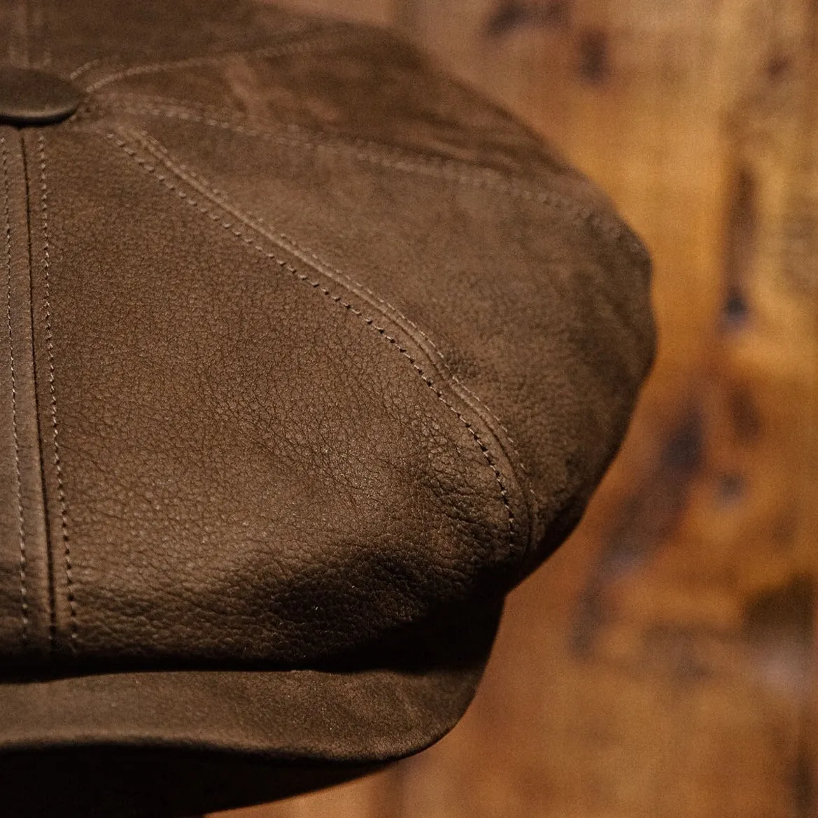 Eight Piece Brown Leather Newsboy Cap