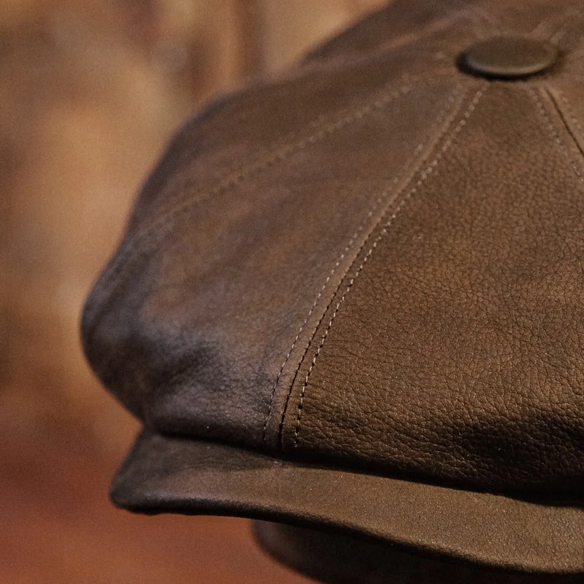 Eight Piece Brown Leather Newsboy Cap