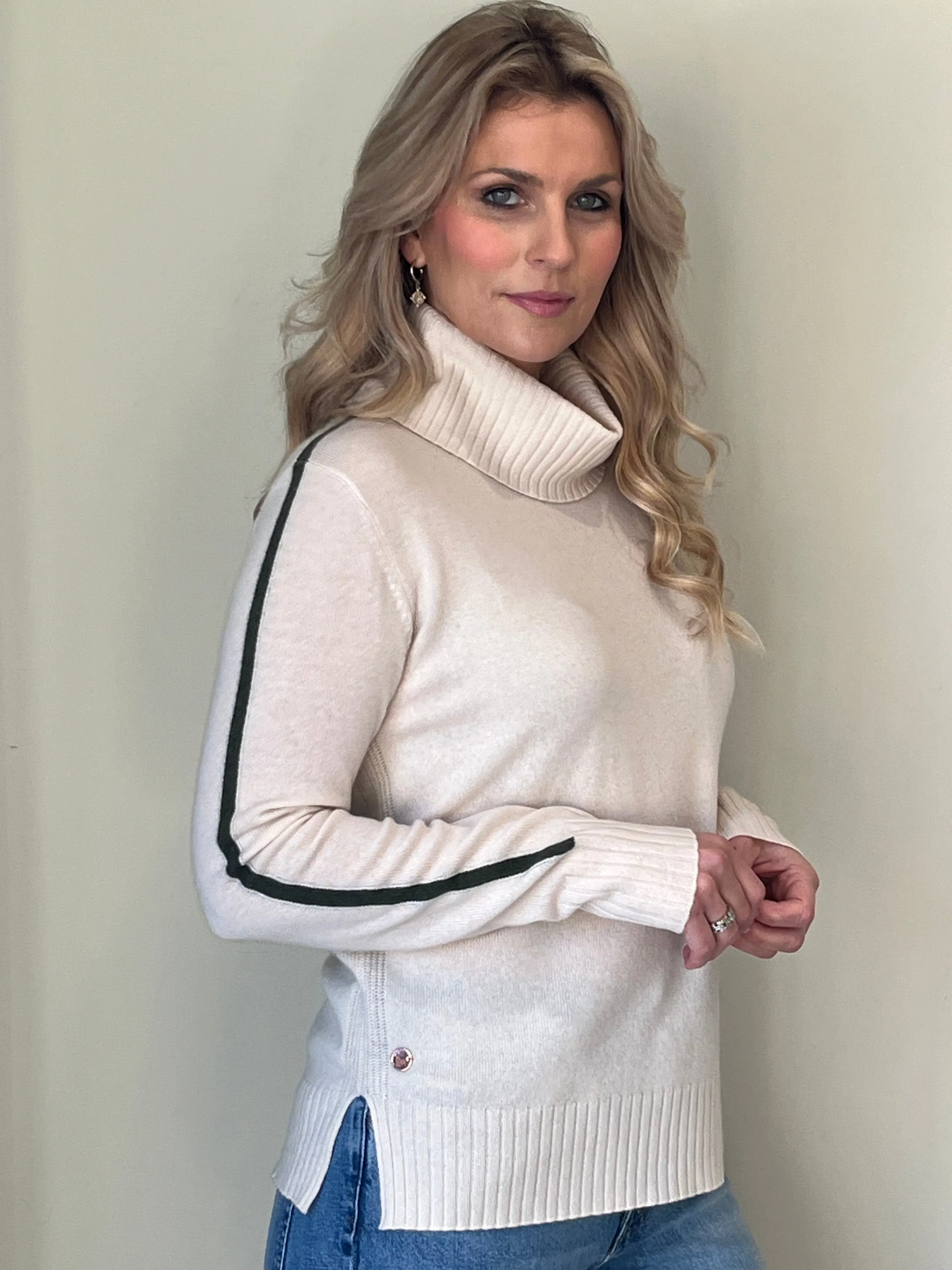 Winter white rib detail roll neck with olive green stripe intarsia detail